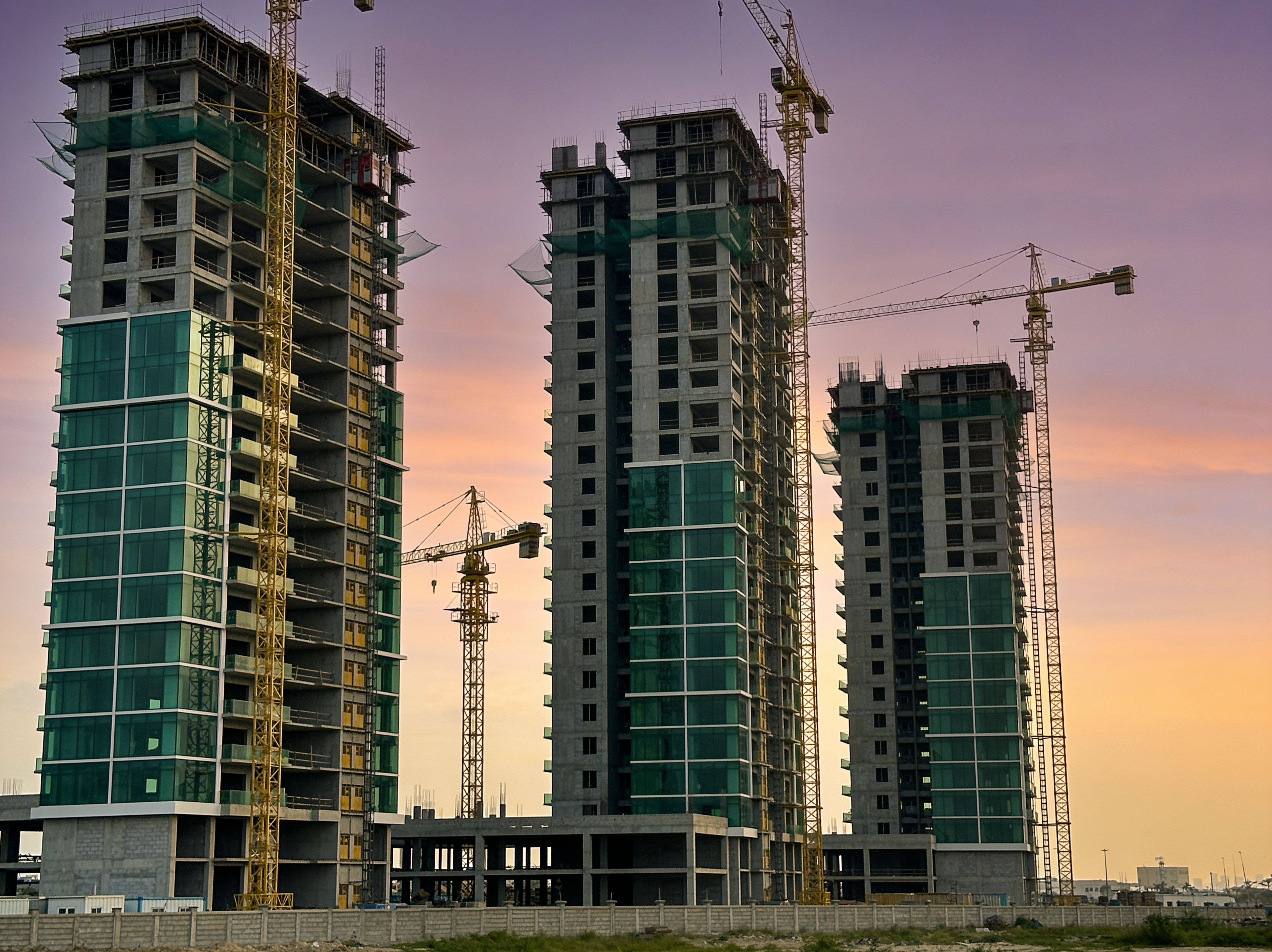 Luxury commercial tower at dusk — Akilapa Real Estate Development